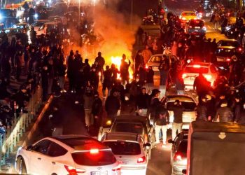 Republicans light cigars, cigarettes on burning photos of Khamenei to show support for Iranian protesters